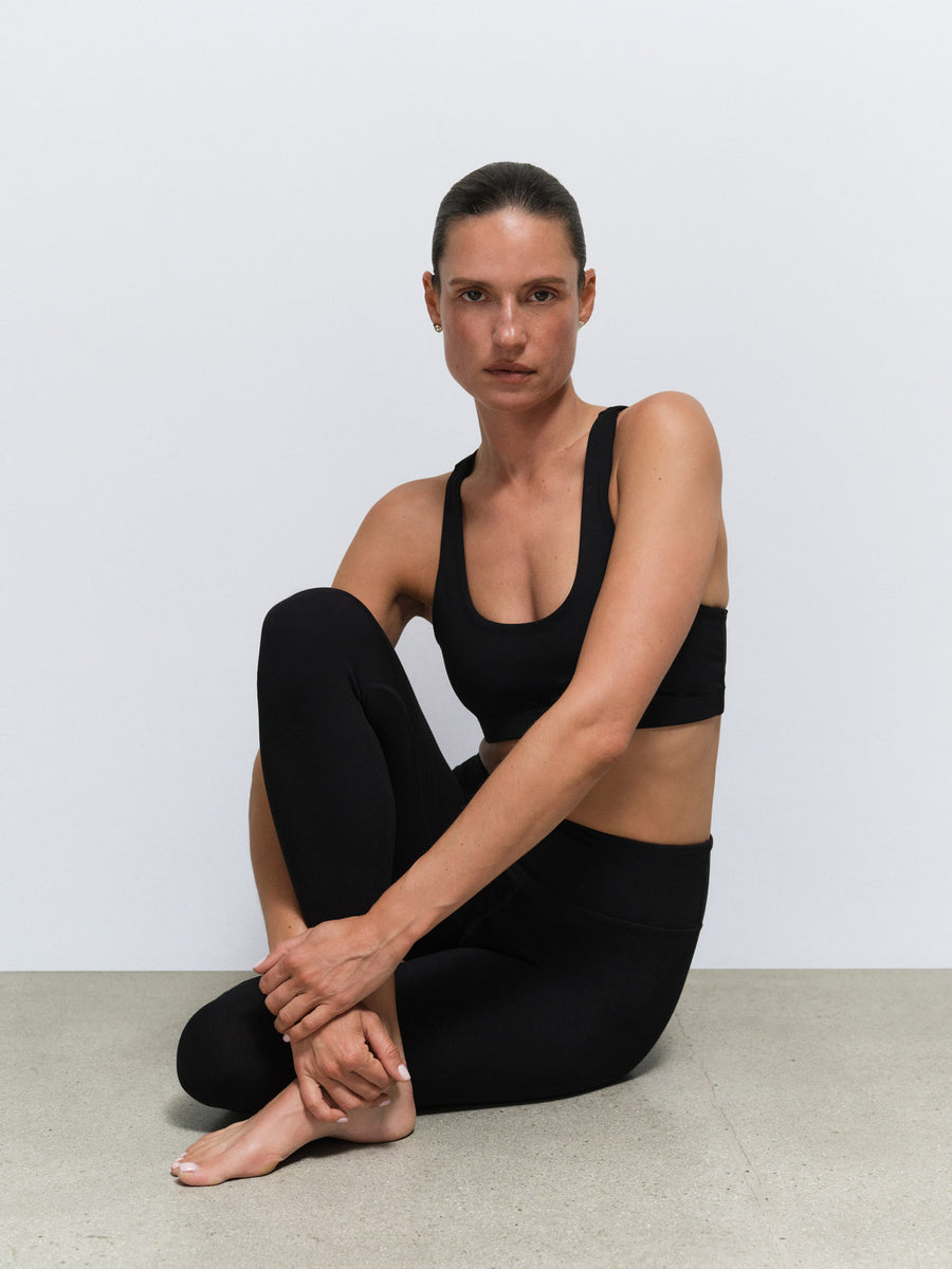 Organic Stretch Sports Bra Midi Legging in Jet Black — product photo