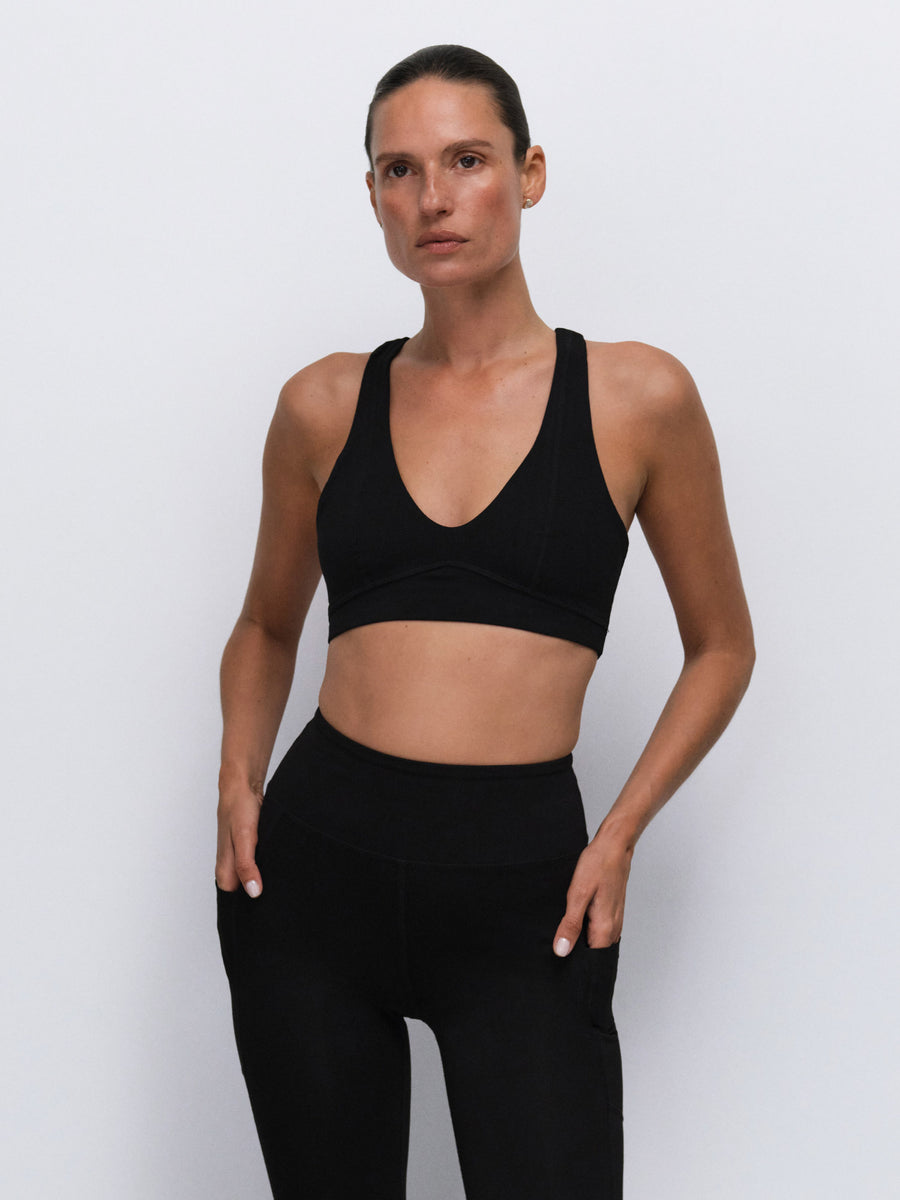 Organic Stretch Vneck Bra Midi Legging With Pockets in Jet Black — product photo