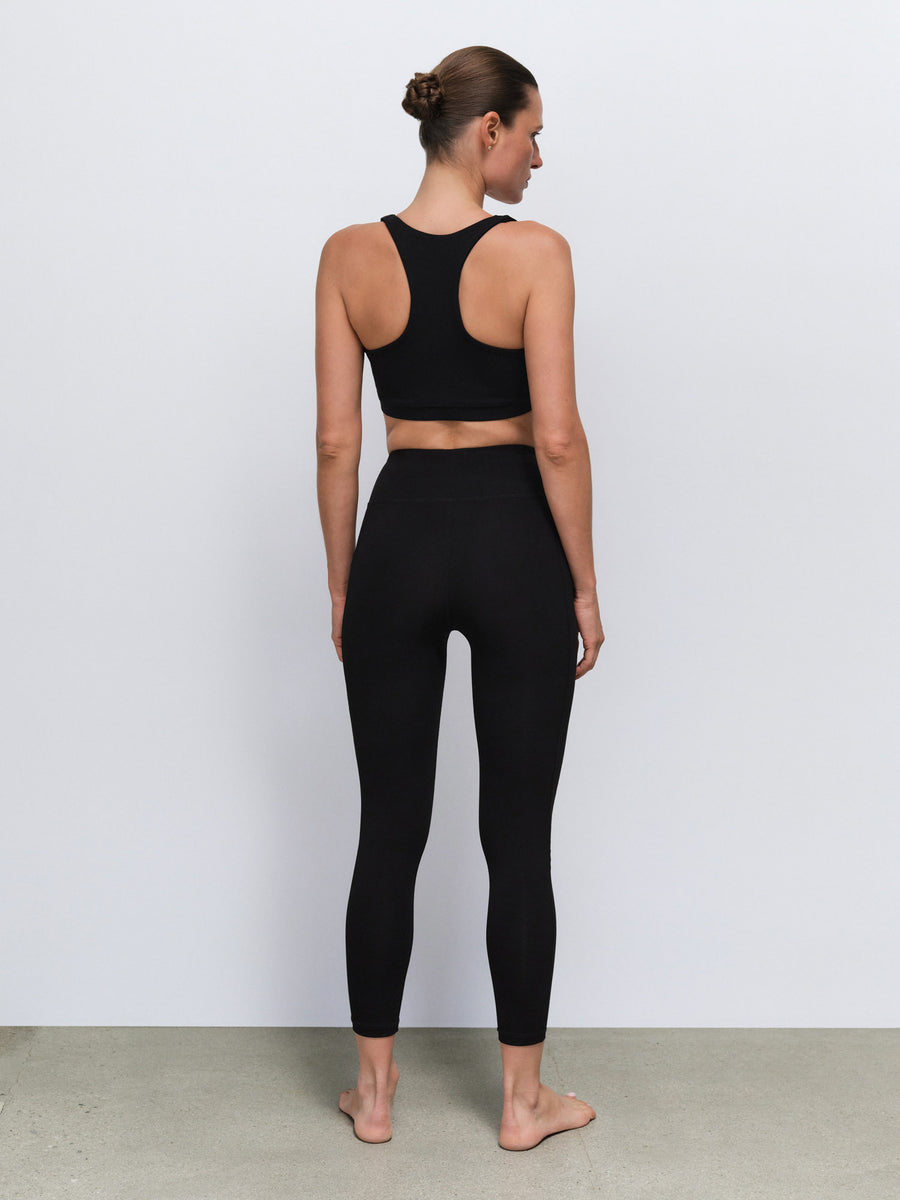 Organic Stretch Vneck Bra Midi Legging With Pockets in Jet Black — product photo