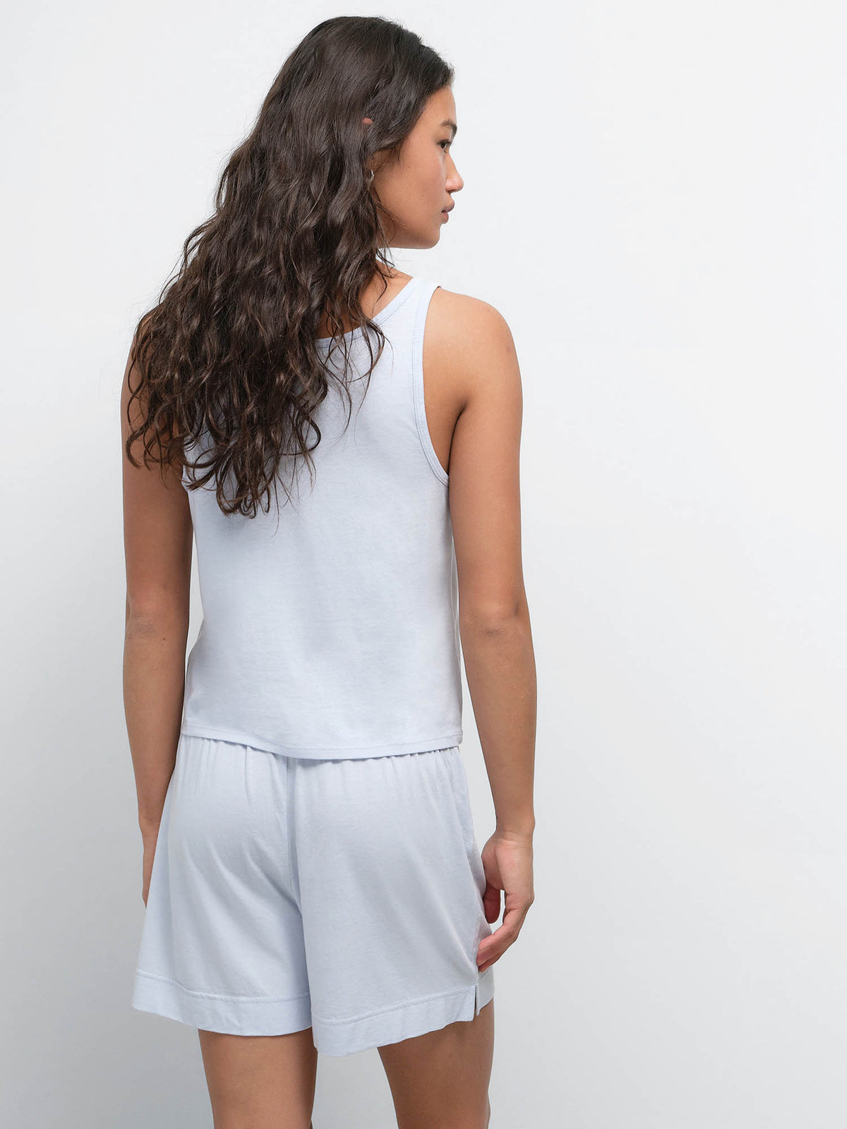 Back view of model wearing the Tencel Sleep Scoop Tank and Boxer Short in Powder