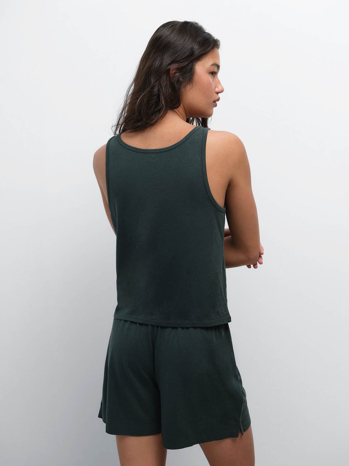 Back view of model wearing the Tencel Sleep Scoop Tank and Boxer Short in Balsam