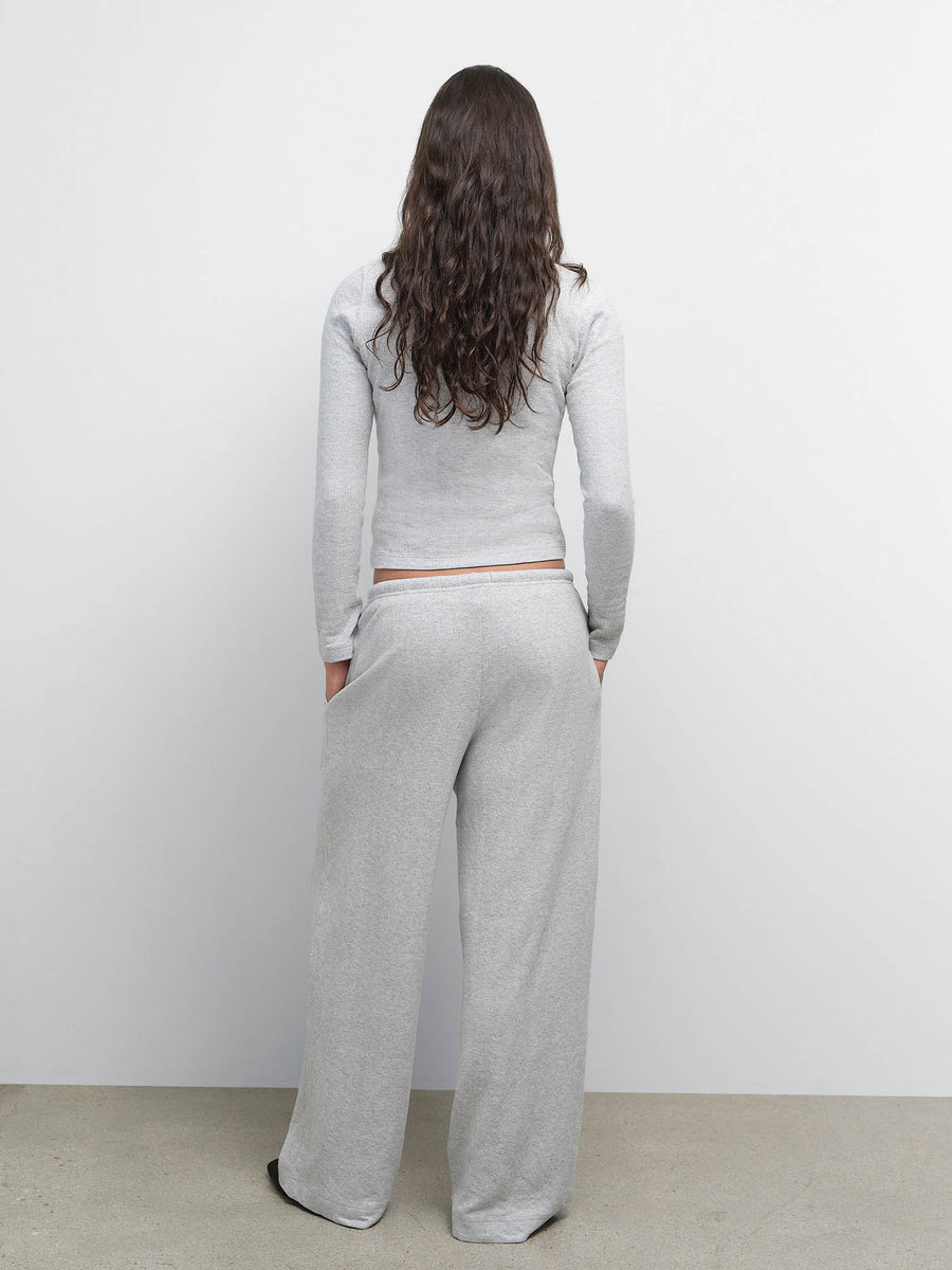 Back view of model wearing the Organic Pointelle Henley and Pant in Heather Grey