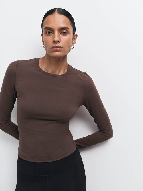 Model in an organic stretch long sleeve top in Mocha with black bottoms – MATE the Label